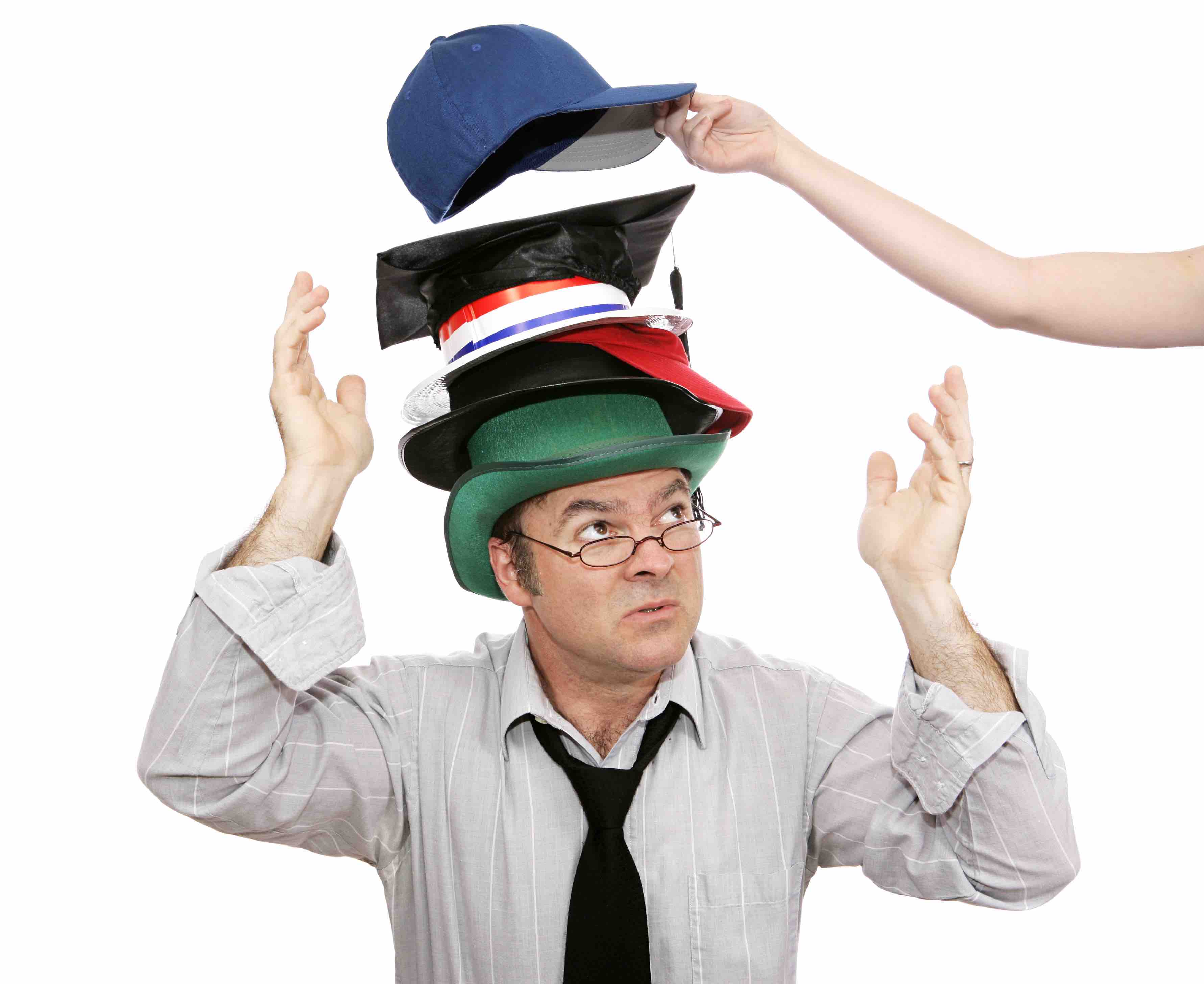 Overwhelmed businessman with more and more responsibility - represented by hats.  Another being added.